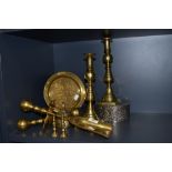 A selection of brass wares including companion set and candle sticks