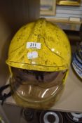 A modern fireman helmet with fold out visor marked MSA Gallet