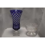 A large crstal glass vase having cut body with Bristol blue colour