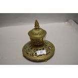 A Victorian brass ink well having lead liner and ornate styling.AF.