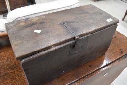 A small 18th century oak box, of planked construction with iron strap hinges and lock plate.