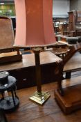 A brass table lamp having Corinthian style column