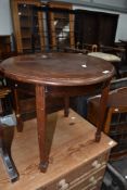 An Edwardian mahogany occasional coffee table on square tapered legs and spade feet