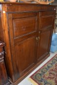 A period oak cupboard having shelved interior