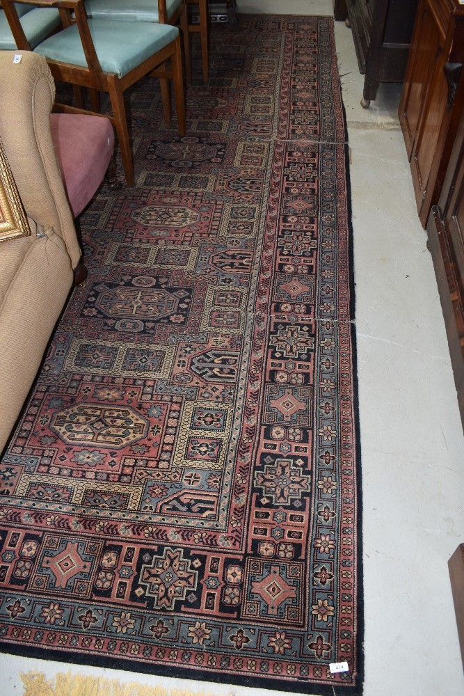 A traditional carpet square, cut piece to one edge