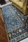 A modern carpet square , in shades of blue, approx. 390 x 307cm