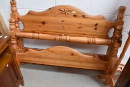 A modern pine double bed frame