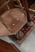 A 1940's octagonal oak coffee table, with barley twist supports.