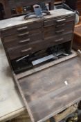 A early 20th century engineers tool chest, containing various tools, punches, calipers etc.