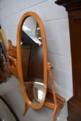 A modern rubberwood cheval mirror