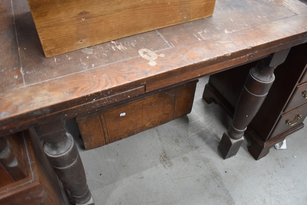 An early 20th century drawer leaf oak table.