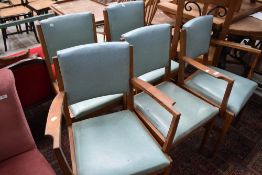 A group of five 1950's oak chairs with mottled blue rexine padded seats and backs.