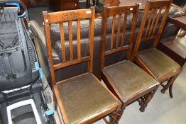 Three early 20th Century oak rail back dining chairs