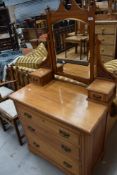 A late Victorian dressing table with chest of three drawers having bevel edged mirror