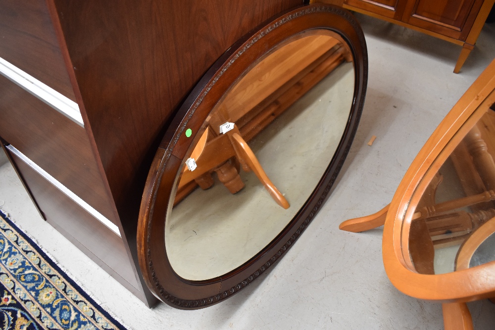 An early 20th Century mahogany oval wall mirror