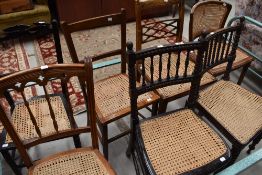 A group of seven 19th century and later cane seated bedroom chairs, including two bobbin turned