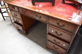 A reproduction Regency pedestal desk, width approx. 137cm