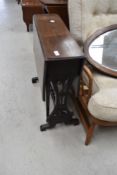 A Sutherland style drop leaf side table in mahogany