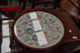 Two antique trays one having embroidery under glass,sold with a similar reproduction tray having
