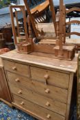 A stripped pine Victorian chest of two over three drawers and later natural pine dressing table