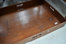 A late 19th/early 20th century oak butlers tray, of rectangular form with pierced handles.
