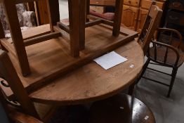 A rustic heavy extending kitchen table and chairs