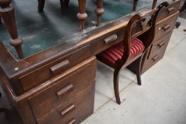 An art deco mahogany desk having three draws to either side with three above.AF
