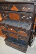 A Victorian aesthetic period oak and burr-elm Wellington chest by R Crosby & Son, Liverpool,