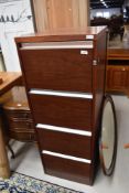 A modern mahogany effect four drawer filing cabinet