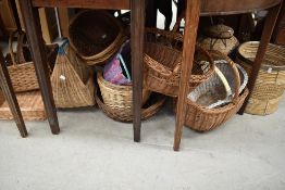 A large collection of mixed vintage baskets.