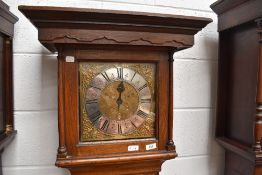 An 18th Century oak cased long cased clock having square hood, 30 hour movement and brass dial,