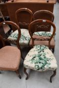 A set of four late 19th/early 20th century mahogany balloon back chairs with sprung serpentine