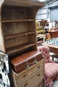 A pine cabinet, formally the interior of a wardrobe section