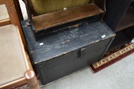 A painted pine tool chest, of hinged rectangular form with planked construction.