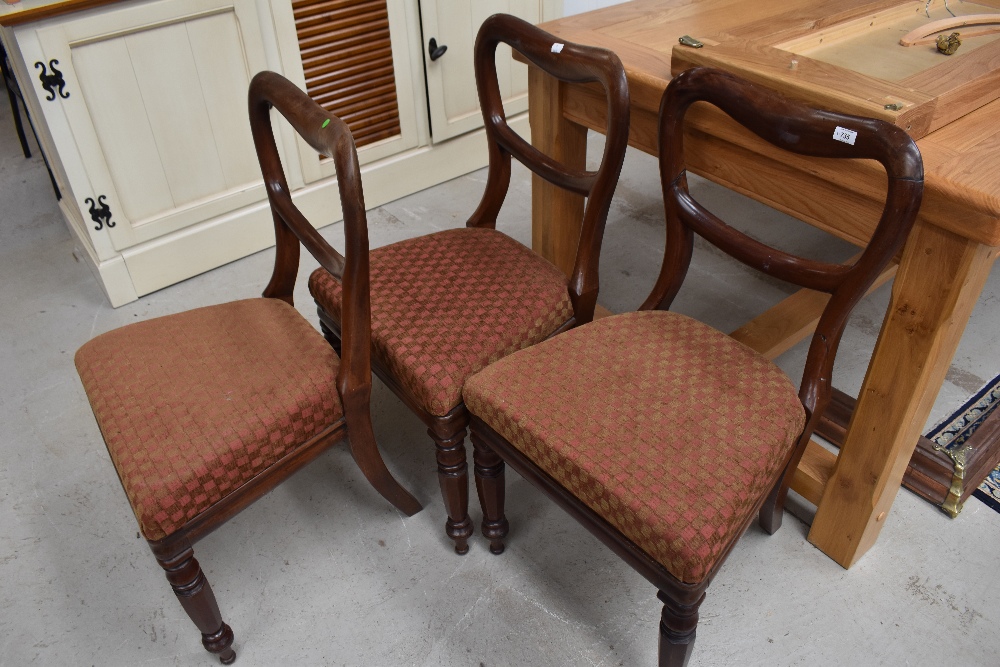 Three Victorian mahogany framed balloon back dining chairs