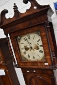 A Victorian mahogany cased long case clock having broken swan neck pediment, 8 day movement and