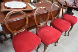 Four French style late Victorian balloon back chairs.