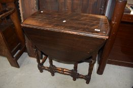 An early 20th Century oak twist and turn gateleg table, compact size, width approx. 72cm