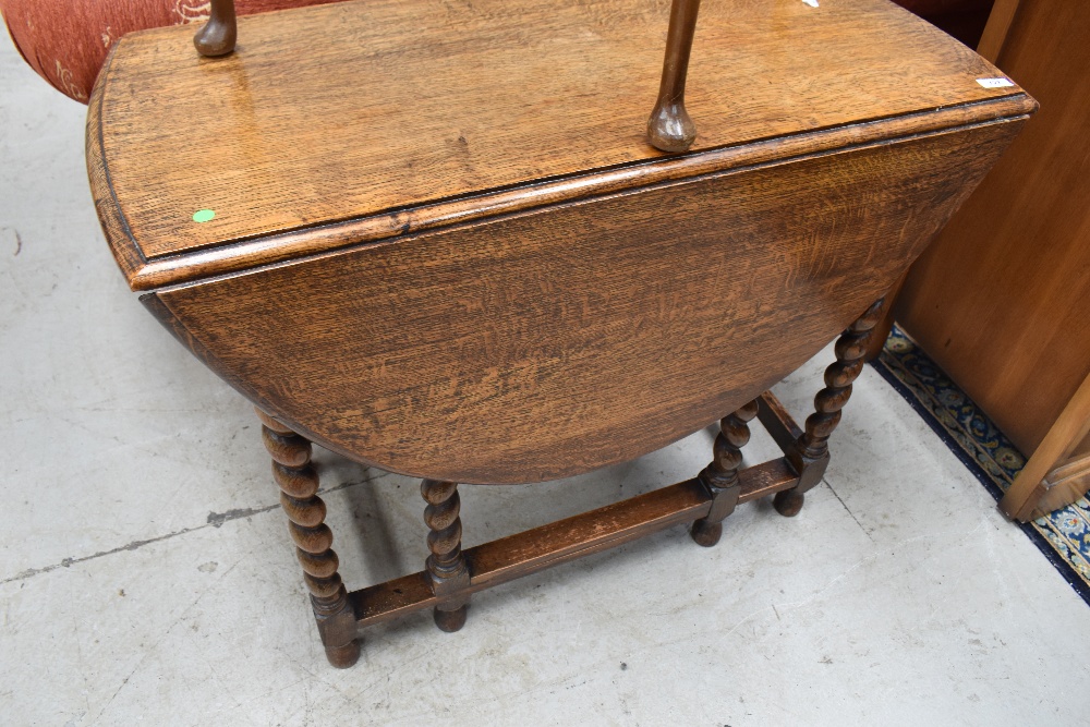 An early to mid 20th Century oak twist gateleg dining table