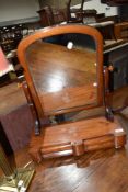 A Victorian mahogany toilet mirror having double drawer base