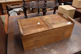 A vintage wooden sewing box having internal compartmental tray.