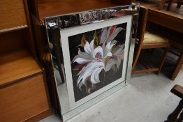 A floral print, after Sally Scaffold, in mirrored frame, slight chip to frame