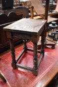 An 18th century style oak join stool, with moulded rails and turned supports, re-applied top with