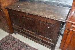 A 19th century oak three panel mule chest, with long single drawer to base