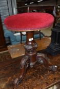 A Victorian mahogany style revolving piano stool, the foliate carving with star-incised decoration