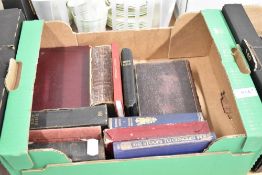 A miscellany of antique books including Dickens, Longfellows poetry, Wordsworth amongst others.