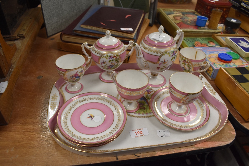 A Vienna porcelain tea service and tray set with birds of paradise design on pink ground