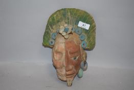 A vintage terracotta Aztec or South American mask representing life and death