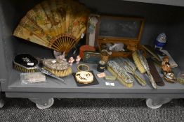 A selection of curios trinkets and dressing table items including lacquer work brush set and buttons
