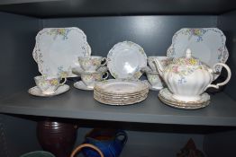 An early 20th century part tea service by Grosvenor having enamel floral pattern